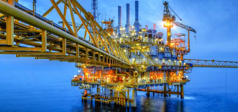 Offshore oil rig seen at dusk