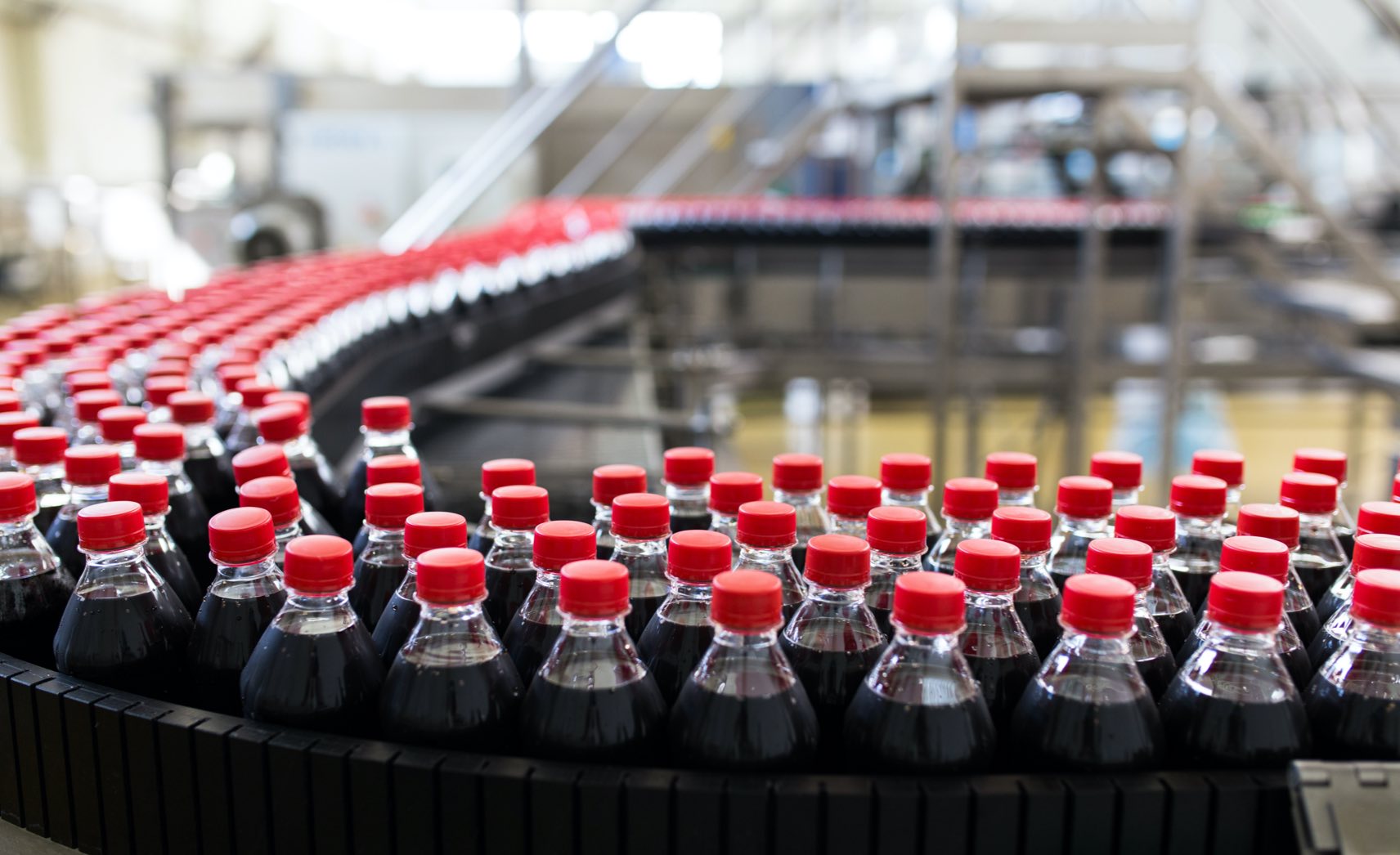 soft drinks on conveyor belt in big factory